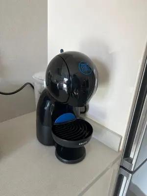 a black coffee maker sitting on top of a counter at Loft moderno en buena ubicación in Terrassa