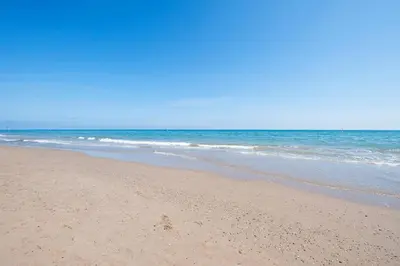 a sandy beach with the ocean in the background at Casa Natura Gava Beach in Gavà