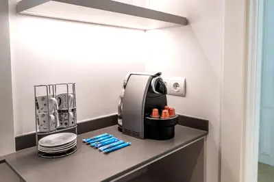 a coffee maker on a counter in a kitchen at Sitges ARENA - dos piscinas frente al mar in Sitges