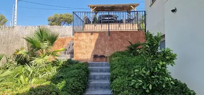 a balcony with a fence and some plants at Villa Contenta Canyelles in Canyelles