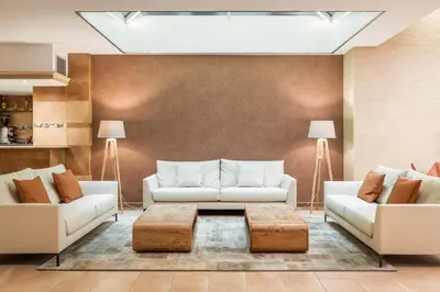a living room with two couches and a coffee table at Petit Palace Eixample in Barcelona