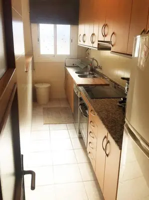 a small kitchen with a sink and a window at MODERNO APARTAMENTO EN EL CENTRO in Vilanova i la Geltrú