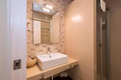 a bathroom with a sink and a mirror at Blanc Guest House in Barcelona