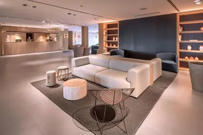 a living room with a couch and a table at Hotel Playafels in Castelldefels