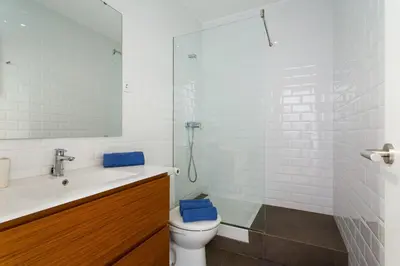 a bathroom with a toilet and a sink and a shower at Gracia Terrace in Barcelona
