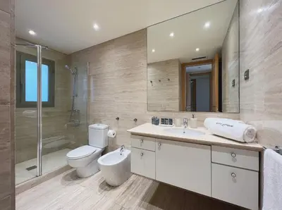 a bathroom with a toilet and a sink and a shower at Stay Unique Apartments Diagonal III in Barcelona