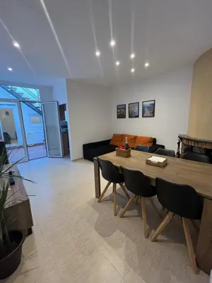 a living room with a table and a couch at Apartamento St Zenon in Arenys de Mar