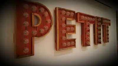 a sign that says f on a wall at Petit Hotel in Barcelona