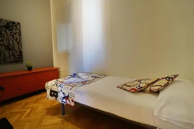 a bed with two pillows on it in a room at Barcelona4Seasons II in Barcelona