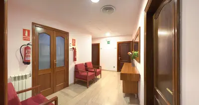 a corridor of a hospital with a waiting room at Alba Hotel in Barcelona