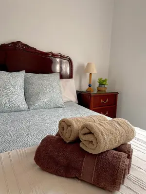 a bedroom with a bed with a towel on it at Refugio en el Parque natural del Montseny in El Brull