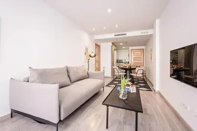 a living room with a couch and a table at Sweett - Casa Fira in Barcelona