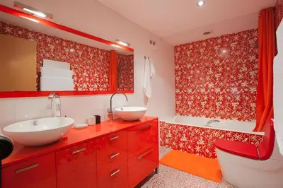 a bathroom with a red vanity with a sink and a tub at Vale Beach in Barcelona