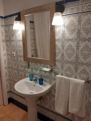 a bathroom with a sink and a mirror at Casa Consell Gran Via, Guest House in Barcelona