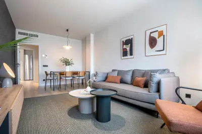 a living room with a couch and a table at Arrivo Apartments in Barcelona