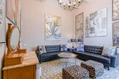 a living room with a couch and a table at El Petit Palauet in Canet de Mar
