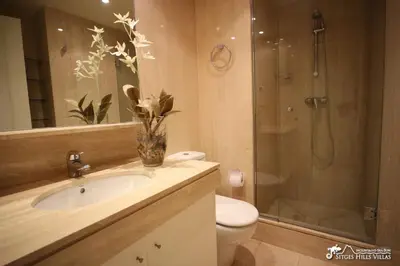 a bathroom with a toilet and a sink and a tub at Apt Parc Del Mar in Sitges very near Beach in Sitges