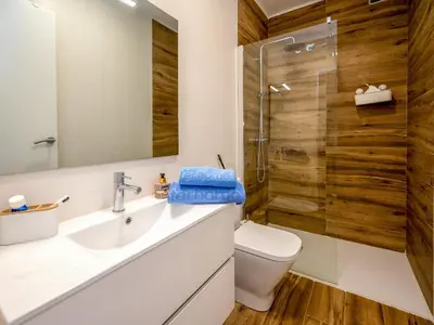a bathroom with a toilet and a sink and a shower at Apartment Millenium by Interhome in Premia de Dalt