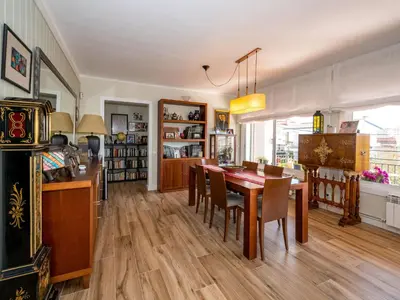 a kitchen and dining room with a table and chairs at Apartment Millenium by Interhome in Premia de Dalt