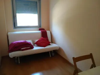 a small room with a bench with pillows on it at 3 BEDROOMS, 2 BATHROOMS FOR 6 PAX, SWIMMING POOL, FREE PARKING and NEAR THE BEACH! in Sant Adria de Besos