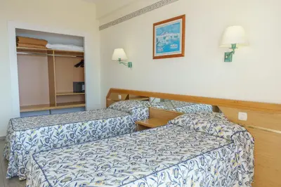 a balcony with a table and two chairs and the ocean at Checkin Catalonia in Calella