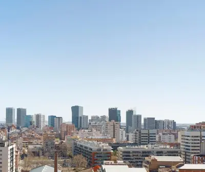 a view of a city skyline with tall buildings at Barcelona Sunny Terrace in Hospitalet de Llobregat
