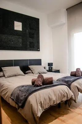 two beds with pillows on them in a bedroom at Exclusiva Villa de Lujo con piscina in Canyelles