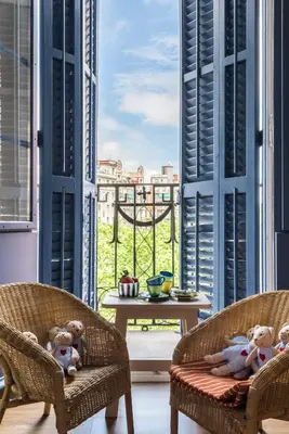 a group of teddy bears sitting in chairs in a room at Bed&BCN Diagonal 5 in Barcelona