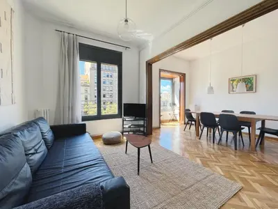 a living room with a couch and a table at Stay U-nique Apartment Passeig de Gràcia III in Barcelona