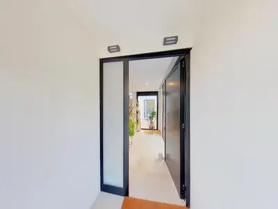 a hallway with a mirror on a wall at Premium Habitat 3 Hermanas in Sant Andreu de Llavaneres