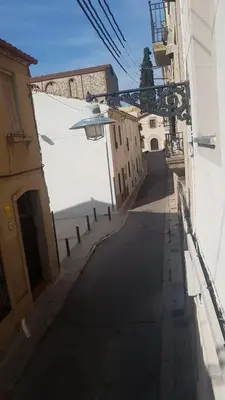an empty street with a street light on the side of a building at CasaBala - Near the beach and Barcelona center in Badalona