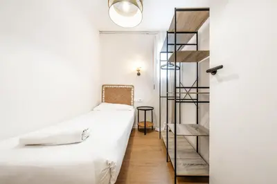 a bathroom with a sink and a mirror at BeBarceloner Eixample Apartments - 4 bedrooms in Barcelona