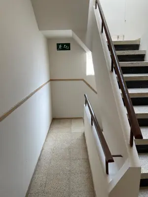 an empty hallway with stairs in a building at Barcelona PR Guesthouse in El Prat de Llobregat