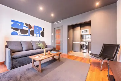a living room with a couch and a table at Sweett - Casa Roma in Barcelona