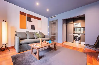 a living room with a couch and a table at Sweett - Casa Roma in Barcelona