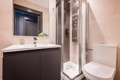 a bathroom with a toilet and a sink and a shower at Sweett - Casa Roma in Barcelona