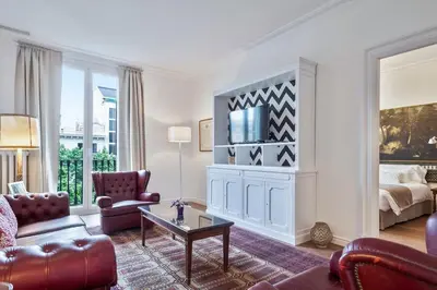 a living room with a couch and a table at The Collection Barcelona - Casa Batlló - Luxury Historic 4BD 4BTH for 9 guests in Barcelona