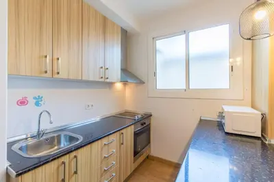 a kitchen with a sink and a window at BeBarceloner Sant Andreu Apartments - Studio in Barcelona