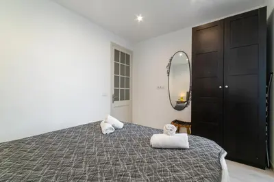 a piece of bread and a glass of wine and cheese at SAGRADA FAMILIA C&D Lovely Apartment in Barcelona