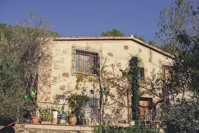 an old building with plants on the side of it at Cottage Eco-Friendly Barcelona country side in La Garriga