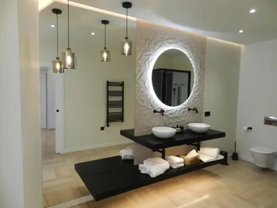 a bathroom with two sinks and a mirror at HOTEL MANEL in Martorell