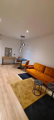 a living room with a couch and a table at HOTEL MANEL in Martorell