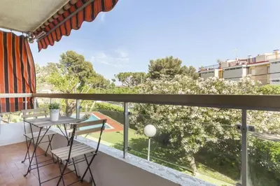 a balcony with a table and a view at HHBCN Beach Apartment Castelldefels #3 in Castelldefels