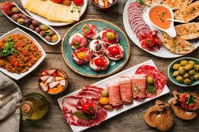 a table with many different types of food on it at Catalunya Casas Elegant Mountain Villa just 30km to Barcelona in Corbera de Llobregat