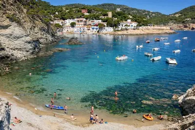 a group of people on a beach in the water at Catalunya Casas Elegant Mountain Villa just 30km to Barcelona in Corbera de Llobregat