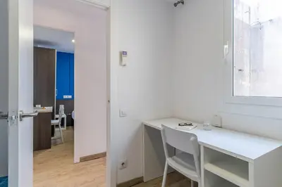 a room with a white desk and a window at AB Nou de la Rambla in Barcelona