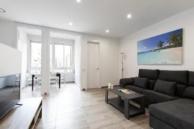 a living room with a couch and a table at AB Comte d'Urgell - 2975 in Barcelona