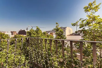 a view of a city from a balcony at The Collection Barcelona - Comfortable 3BD in Poblenou next to the beach only for Families! in Barcelona