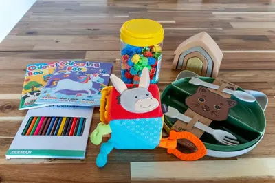 a table with toys and a toy car and a book at The Collection Barcelona - Poblenou only for Families 3BD next to the beach! in Barcelona