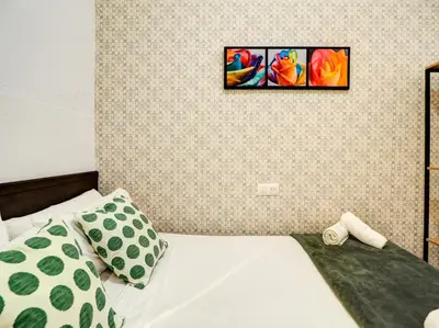 a bedroom with a bed and a picture on the wall at Charming Patio by Hello Homes Sitges in Sitges